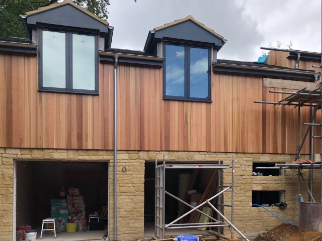 31 Co2 Cedar® House Clad in Western Red Cedar Shadow Gap 31 Co2 Cedar® House Cladding in Red Cedar